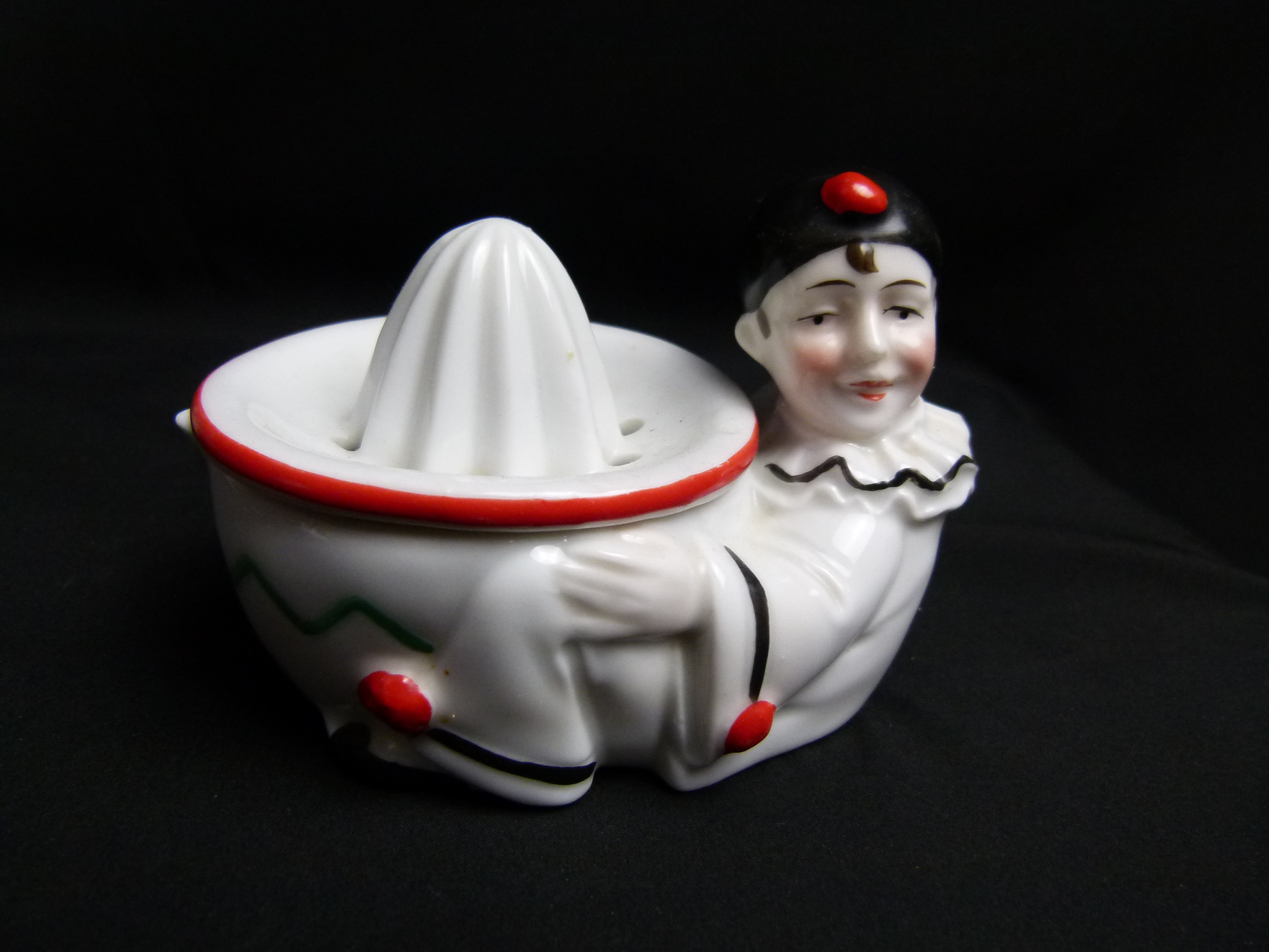 Antike Harlekin Zitronenpresse aus Porzellan