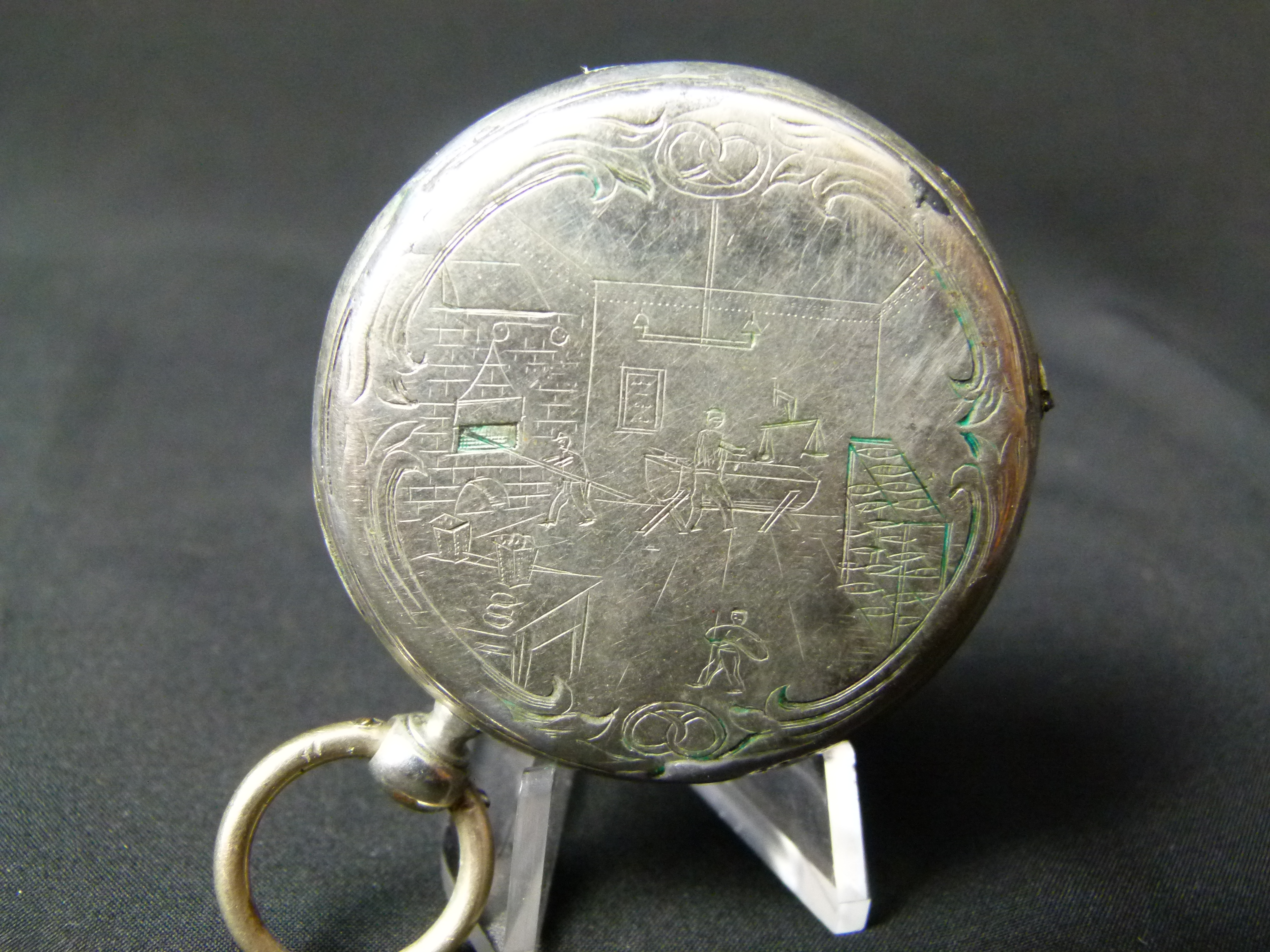 Antike Spindeluhr mit Gravur einer Backstube Ankre